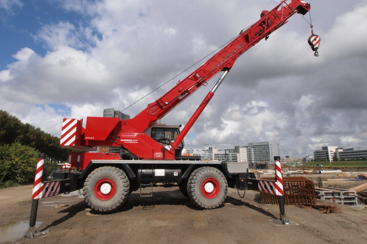 Mobile crane set up on outriggers ready to lift