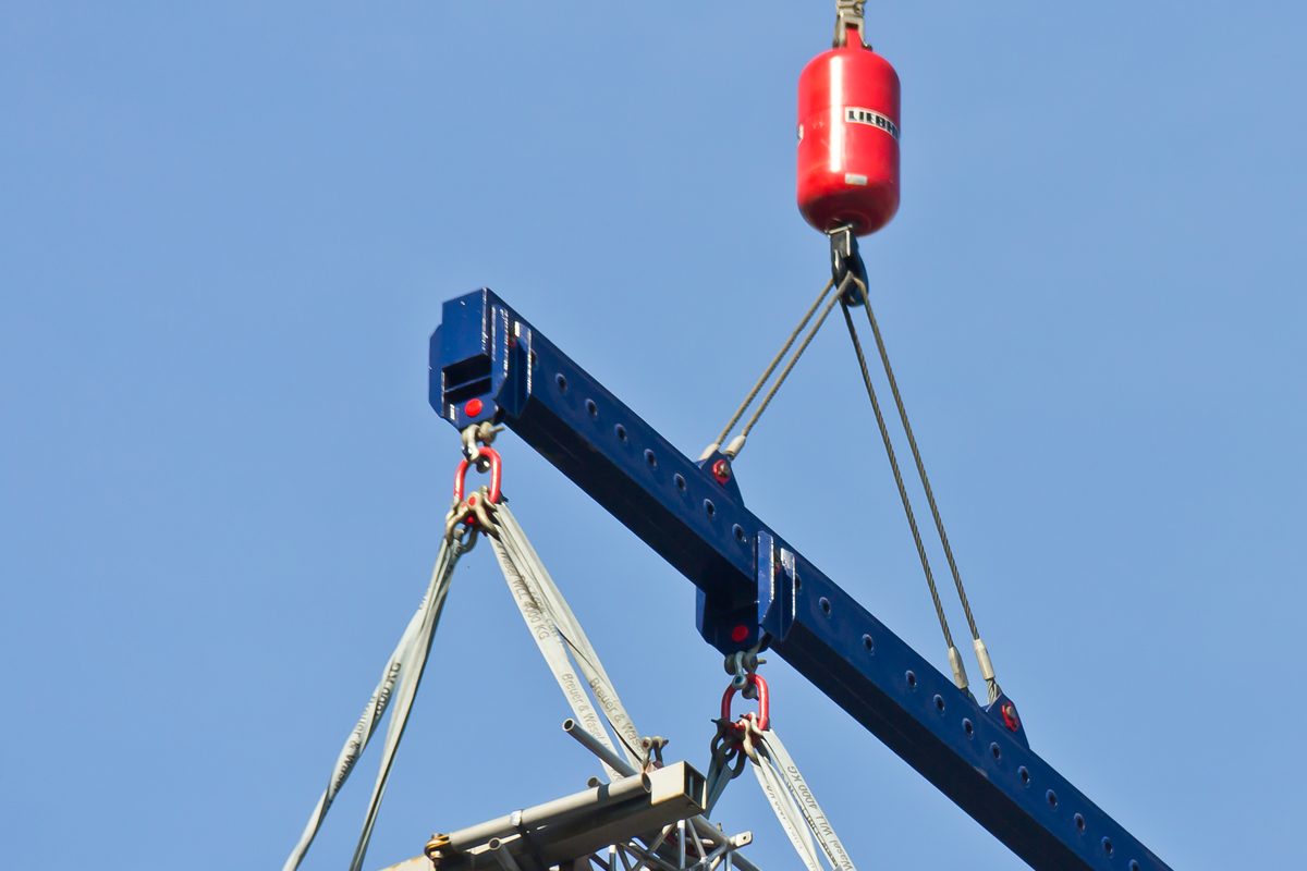 Spreader beam and slings rigged for a precision lift